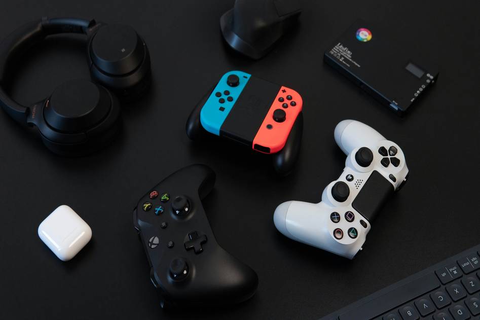 Gaming controller and streaming device on dark background